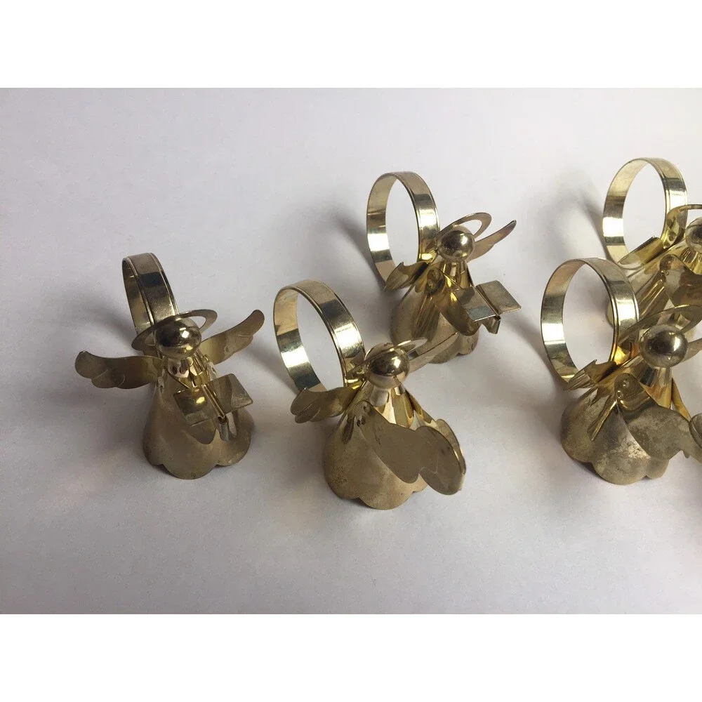 Set of 8 vintage napkin rings trumpet singing drums and candle
